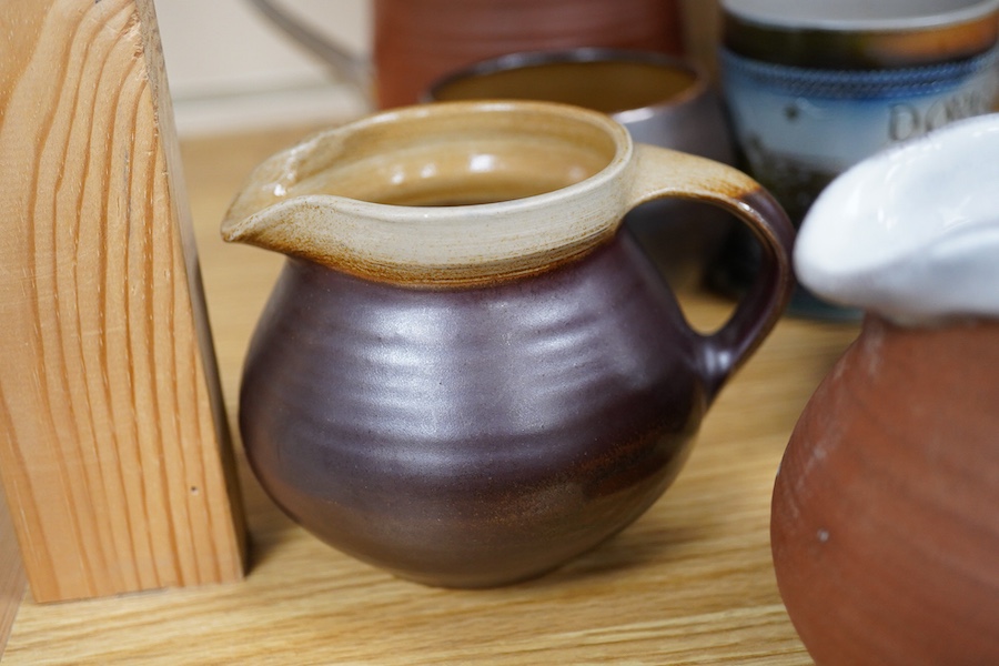 Guy Sydenham (1916-2005), studio pottery comprising a wall pocket, two jugs, Doris (sister-in-law) mug, coffee pot and cover, and a beaker, largest 19cm high